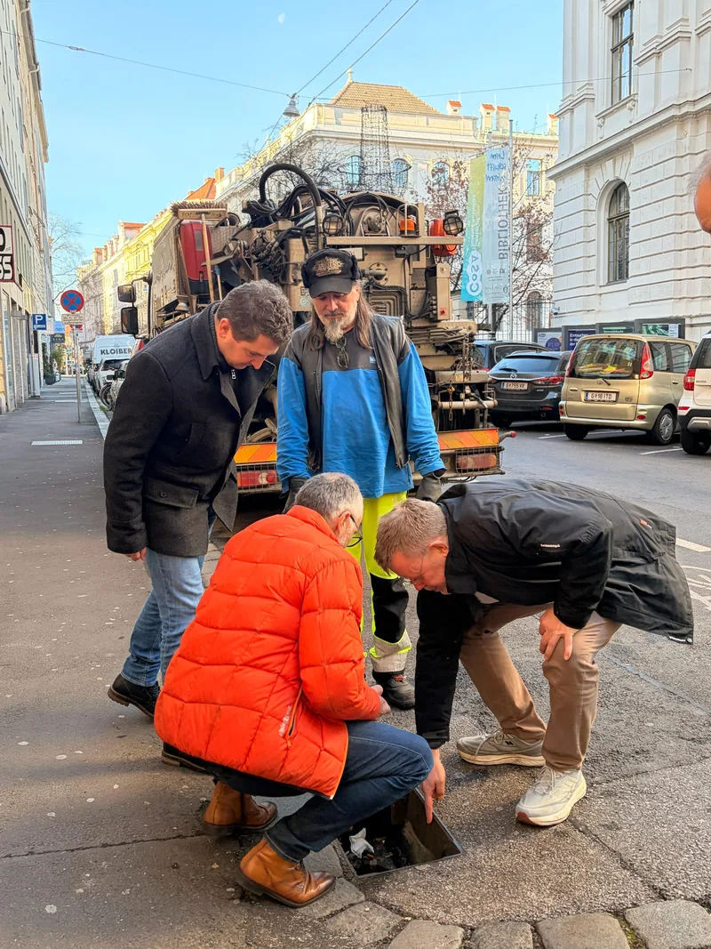 City engineers inspecting an open road drain